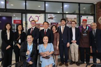 A group photo was taken with delegates from TIKA, TICA, and APCD at the 60+ Plus Bakery & Café.
