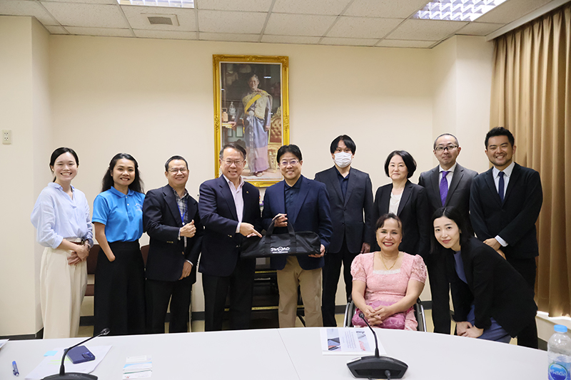 A group photo featuring a delegation from KONNO Corporation, Tokyo Medical Consulting Co., Ltd., and JICA Headquarters with APCD staff.