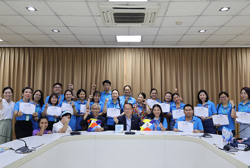 Group photo of delegates from VAN with their completion certificates of the study tour, posing together with APCD staff on 19 February, the day that the group visited APCD and received their certificates.