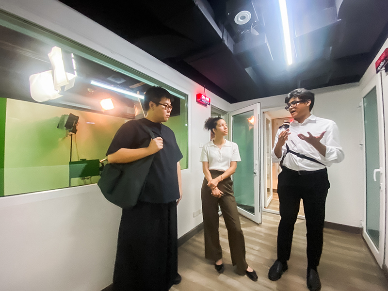 Picture 5: Starting from the left, Mr. Thanawat Deesawat; Ms. Isabella Gacono; and Mr. Krittapol Chamrasromran visit sign language interpreting studio.