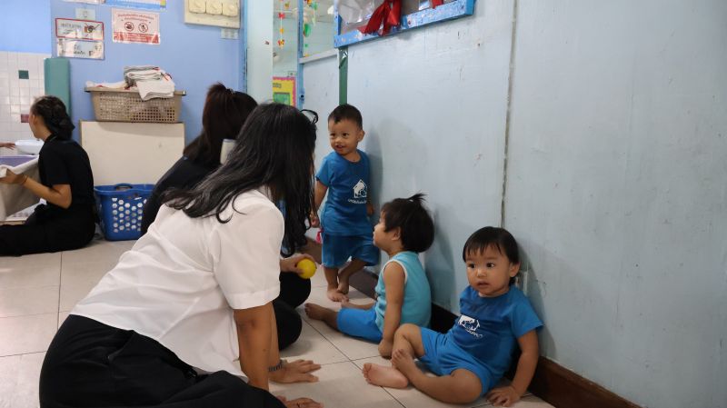 Picture 9: Ms. Wilailekha Somprach, Manager of APCD 60+ Plus Projects, plays with the children