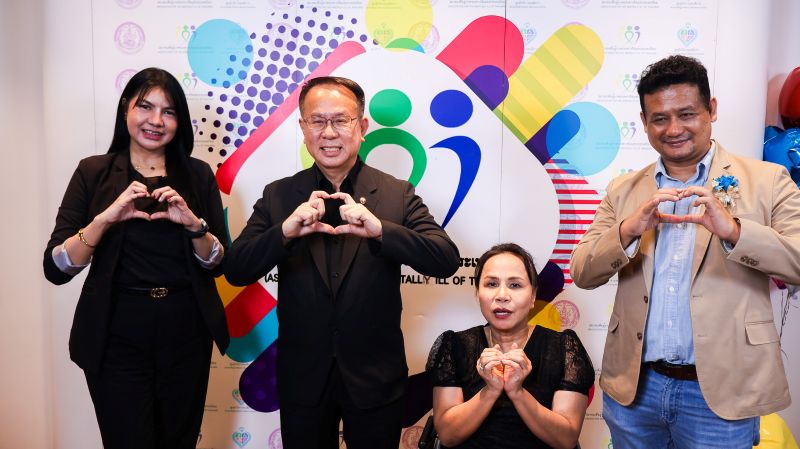 Picture 9: From left to right, the host of the TV show, Mr. Piroon Laismit, Ms. Nongnuch Maytarjittipun (seated in a wheelchair), and a producer pose for a group photo