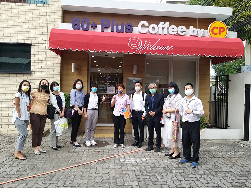 JICA Thailand office staff, JOCVs, and APCD staff gathered in front of the APCD 60+Plus Kitchen by CP.