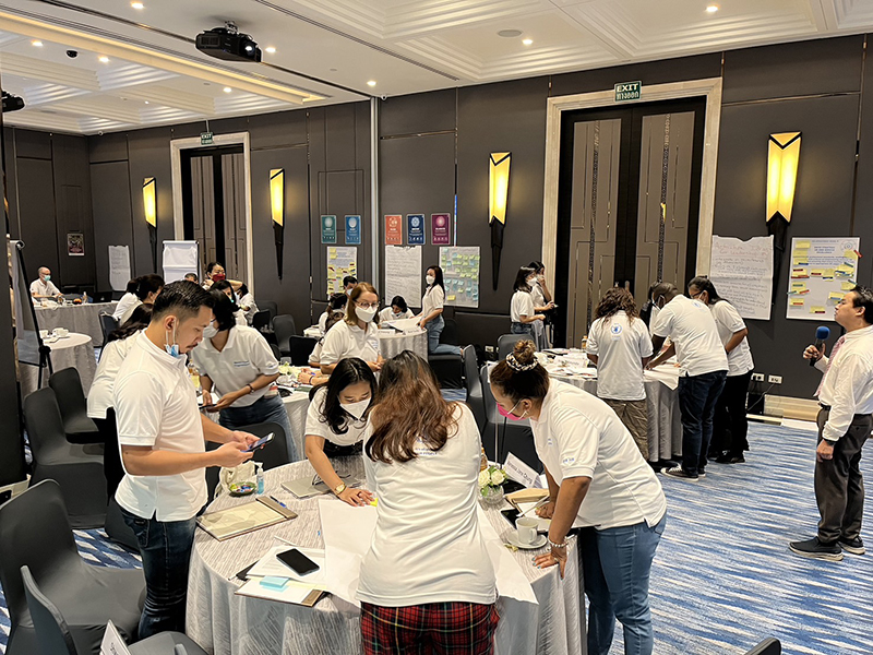 The participants work on another group exercise, this time they were drawing images of what they think ‘equality’ looks like; (Right) Mr. Watcharapol gave instructions to the group.