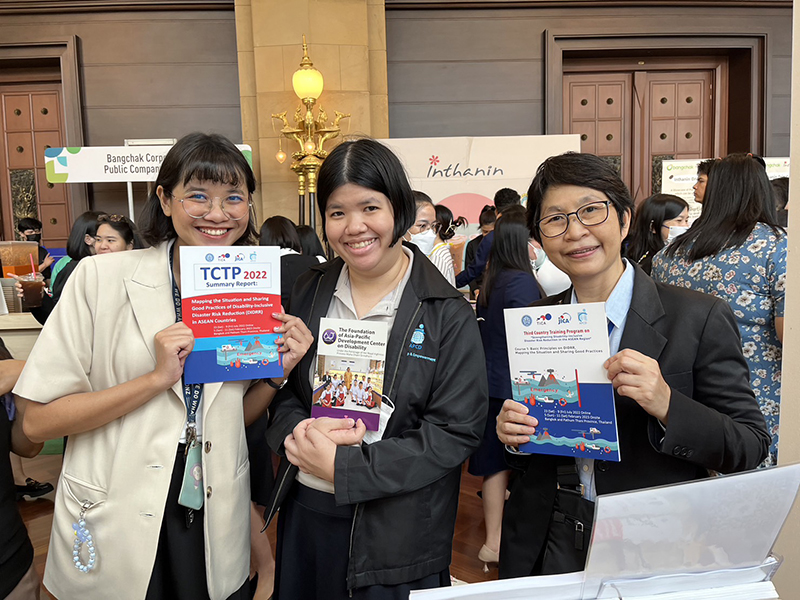 Community Development team welcoming visitors, sharing valuable information at the APCD disability inclusive development booth.