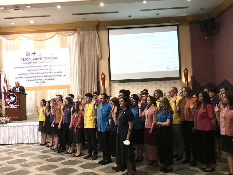 A group photo of the new volunteers and the participants at the swearing in ceremony and 60th anniversary commemoration of Peace Corps Thailand.