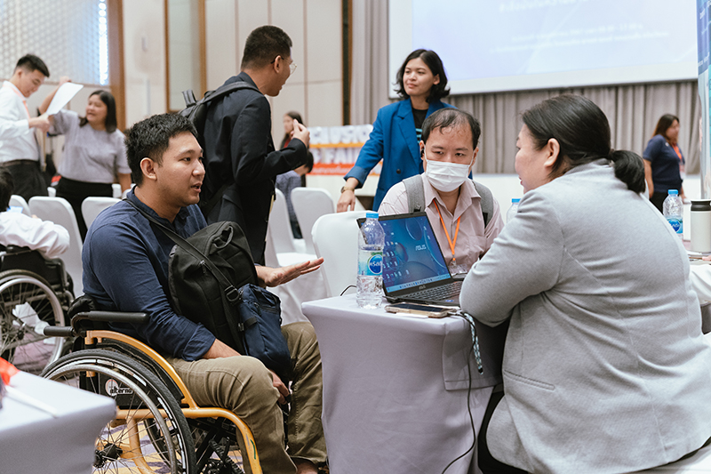 Overall view of persons with disabilities were consulting, looking for a job and having the interview with the company.