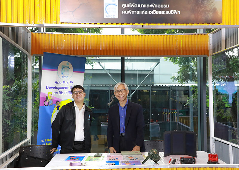 Mr. Somchai Rungsilp and Mr. Watcharapol Chuengcharoen posed proudly in front of the event backdrop, highlighting APCD’s booth on Disability-Inclusive Disaster Risk Reduction (DiDRR), where tools and ideas ensure no one is left behind.