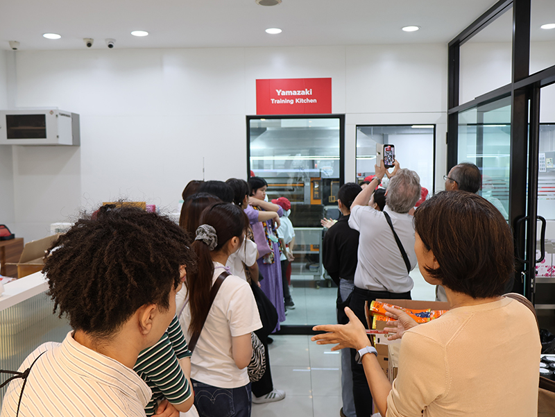 The students observed skill development training in action and witnessed the tangible impact of APCD's implementation, including the 60+ Plus Bakery & Chocolate Café and the 60+ Plus Kitchen by CP.