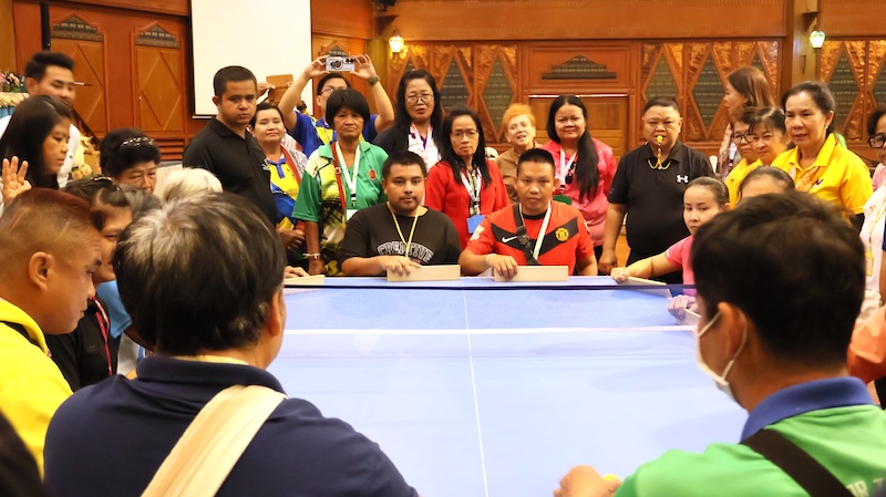 Picture 5: A focused photo captured persons with mental disabilities paying attention and actively participating in a mini Takkyu Volley competition.