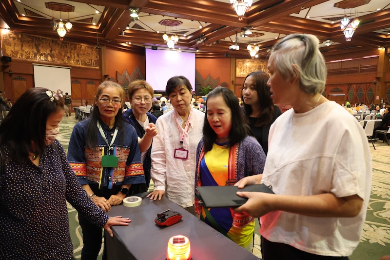 Picture 4: Participants explored and tested the disability inclusive disaster management tools showcased during the break.