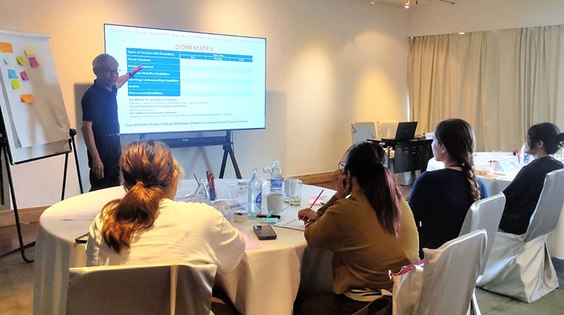 Photo 2: Mr. Somchai Rungsilp shared participants on DIDRR principles, DIDRR matrix tool and APCD practices, using exercises and gathering participant feedback.
