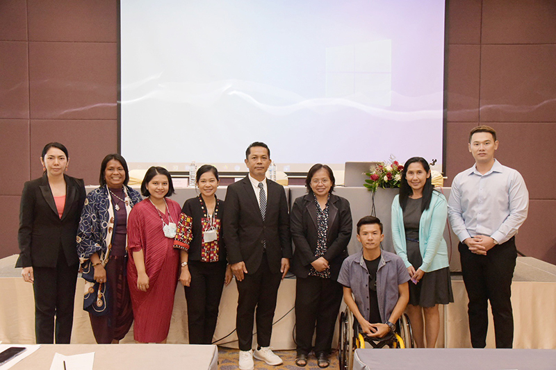 Group photo session of Mr. Sunthorn (middle) and teachers of students with disabilities during the closing program.