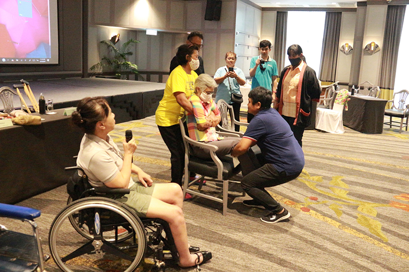 Ms. Nongnuch Maytarjittipun, Executive Secretary to the Executive Director, shared first-hand knowledge on how to carry persons with physical disabilities via role play