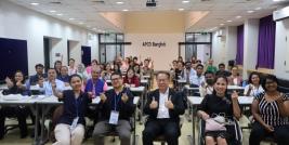 Participants pose for a group photo at the APCD training building.