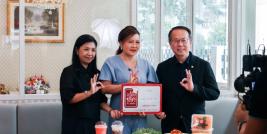 Mr. Piroon Laismit and Ms. Wilailekha Somprach receive the Aroilert seal of approval for the APCD 60+ Plus Kitchen Project.