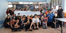 Representatives from three hotels and persons with intellectual disabilities pose for a photo together.