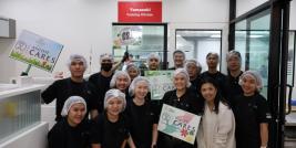 Participants pose for a photo after the bread making session.