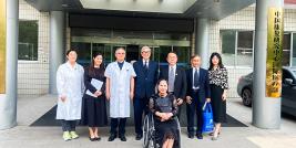Picture 1: A group photo includes Ms. Prinda Khusakul (second person form the left of the row), Dr. Tej Bunnag (the middle of the row), Mr. Piroon Laismit (third person from the right of the row), Mr. Somchai Rungsilp (second person from the right of the row), and Ms. Nongnuch Maytarjittipun (at front and seated in a wheelchair)