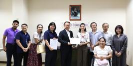 Picture 1: Mr. Piroon Laismit, Executive Director of APCD; Ms. Isabella Gacono; and APCD staff pose for photo with a certificate of completion.