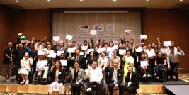 Program Completion group photo: Participants showed their certificates with TICA, JICA, APCD representatives and English – Thai interpreters and Sri Lankan sign language interpreter to celebrate the completion of the training course at the closing ceremony.