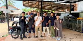 Group photo of the project working team with Mr. Muhummadee Walihassun, the Job Coach, and two persons with disabilities at a car care service facility in Yala Province.