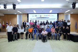 Participants, persons with disabilities, organizers and APCD resource persons in a group photo at the training on "Disability-Inclusive Disaster Risk Reduction Plan of Local Governments" at Burapha University, Chonburi.