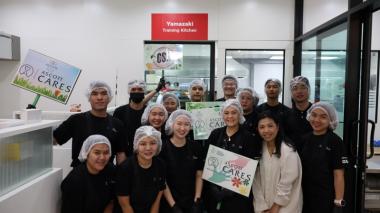 Participants pose for a photo after the bread making session.