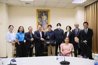 A group photo featuring a delegation from KONNO Corporation, Tokyo Medical Consulting Co., Ltd., and JICA Headquarters with APCD staff.