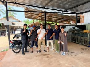 Group photo of the project working team with Mr. Muhummadee Walihassun, the Job Coach, and two persons with disabilities at a car care service facility in Yala Province.
